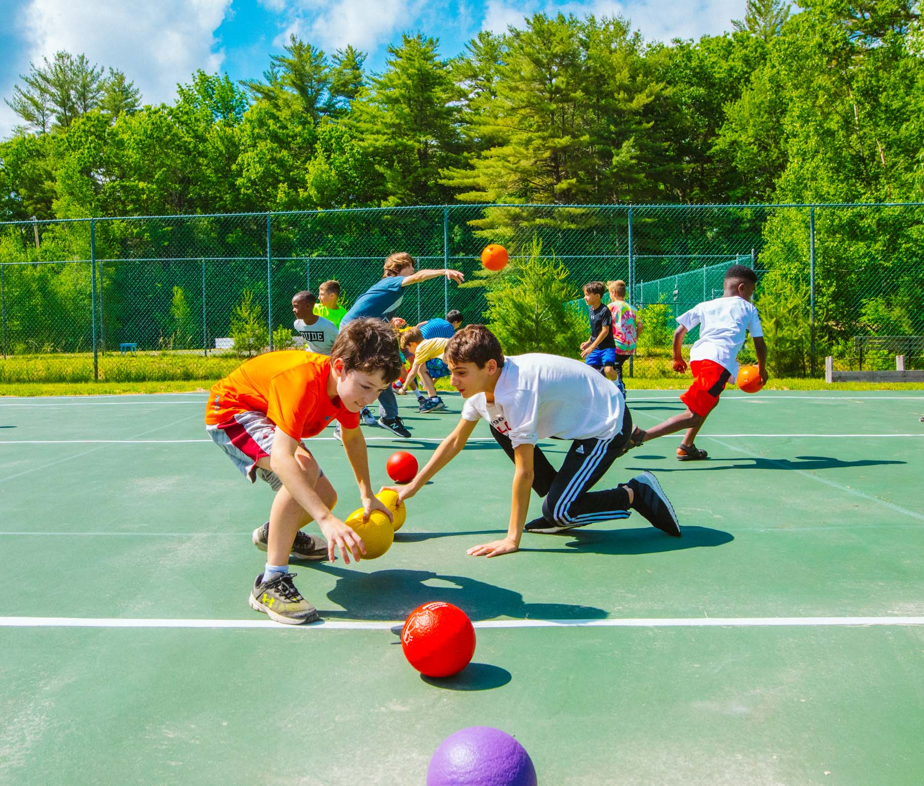 Boys playing dodgeball at Camp Waziyatah