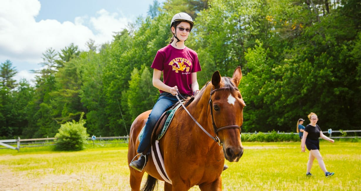 Girl horseback riding at Waziyatah