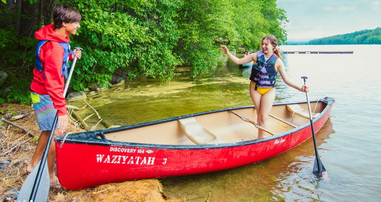 Camper getting out of canoe