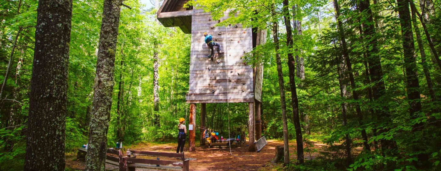 Climbing the rock tower at Camp Waziyatah