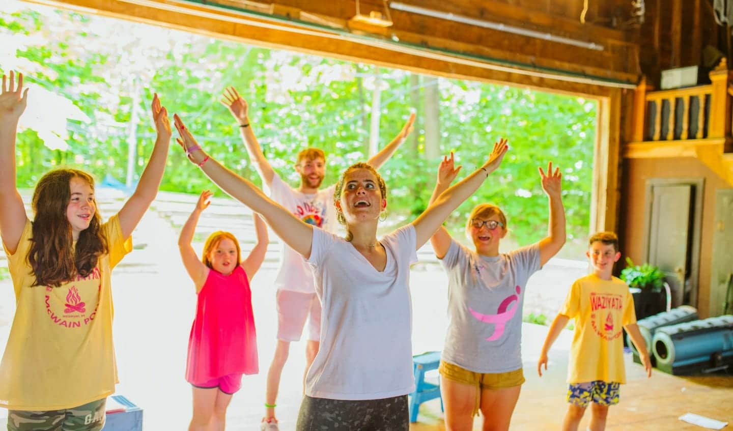 Group of campers dancing